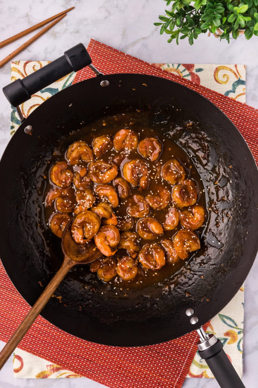 Skillet of Hunan Shrimp with a spoon in it