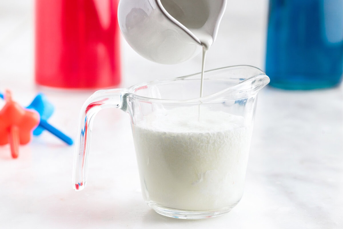 pouring limeade into cream