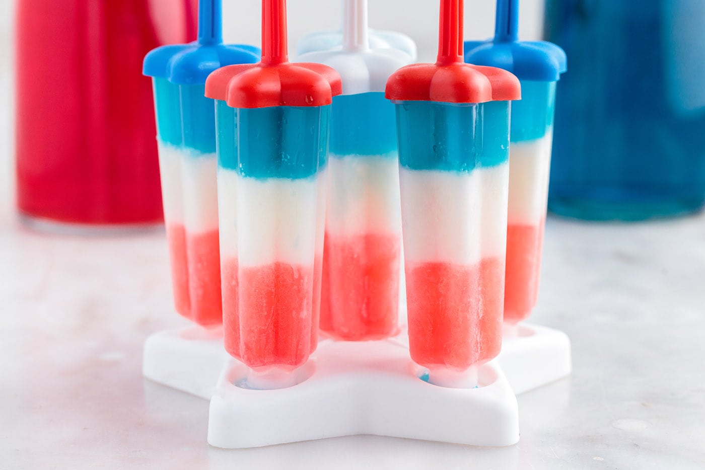 red white and blue popsicles in a mold