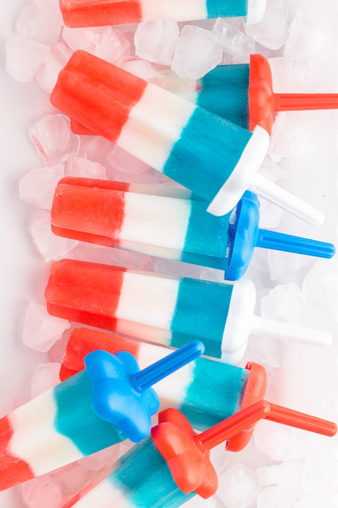 Patriotic Bomb Pops on a serving tray with ice