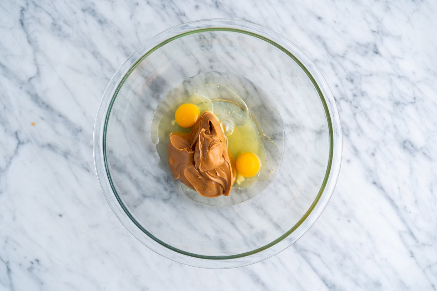 eggs, peanut butter, and oil in a bowl