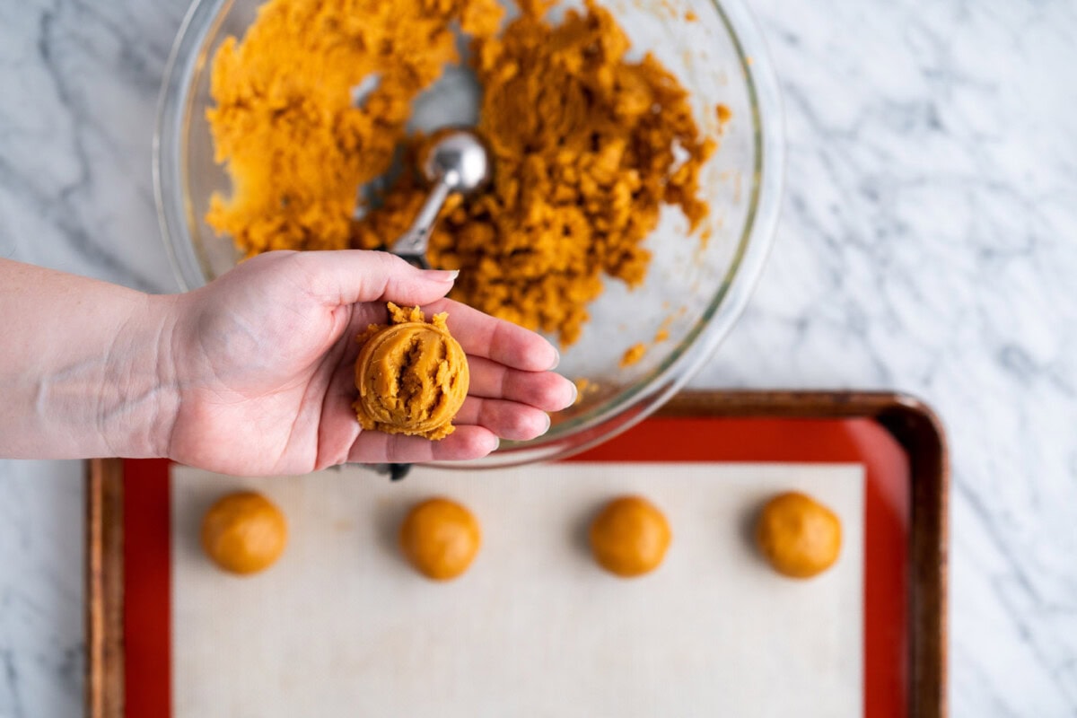 rolling cookie dough into a ball