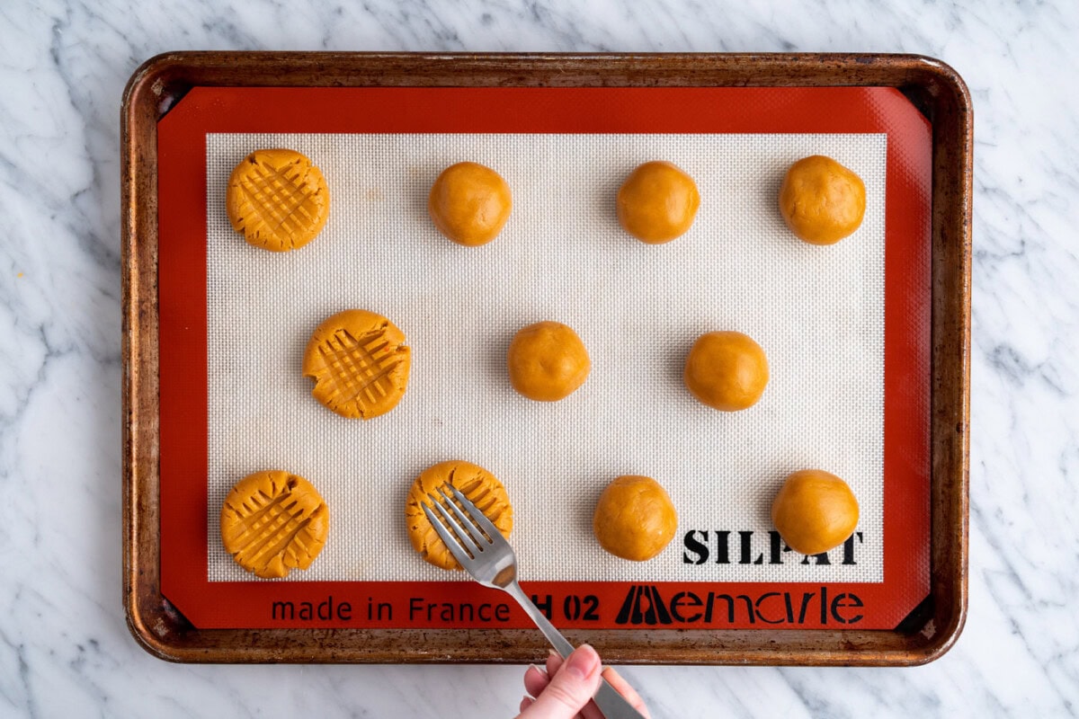 pressing dough balls with a fork