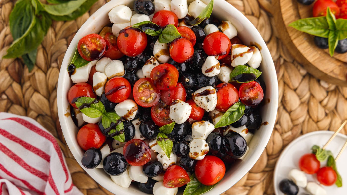 A classic Italian salad gets a delicious twist with the addition of blueberries, which also adds the
