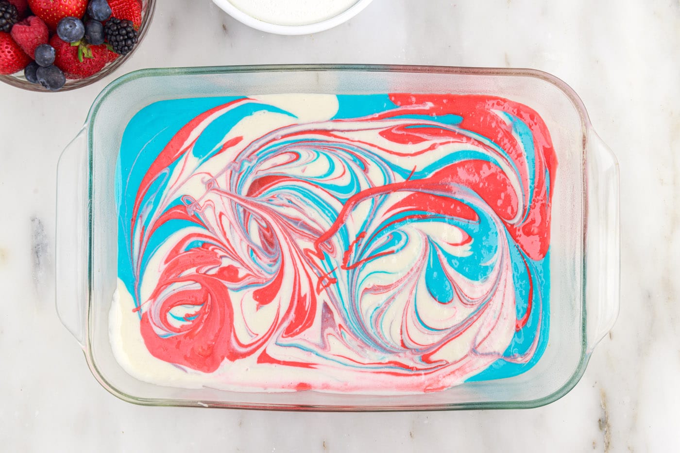 swirled red white and blue cake batter