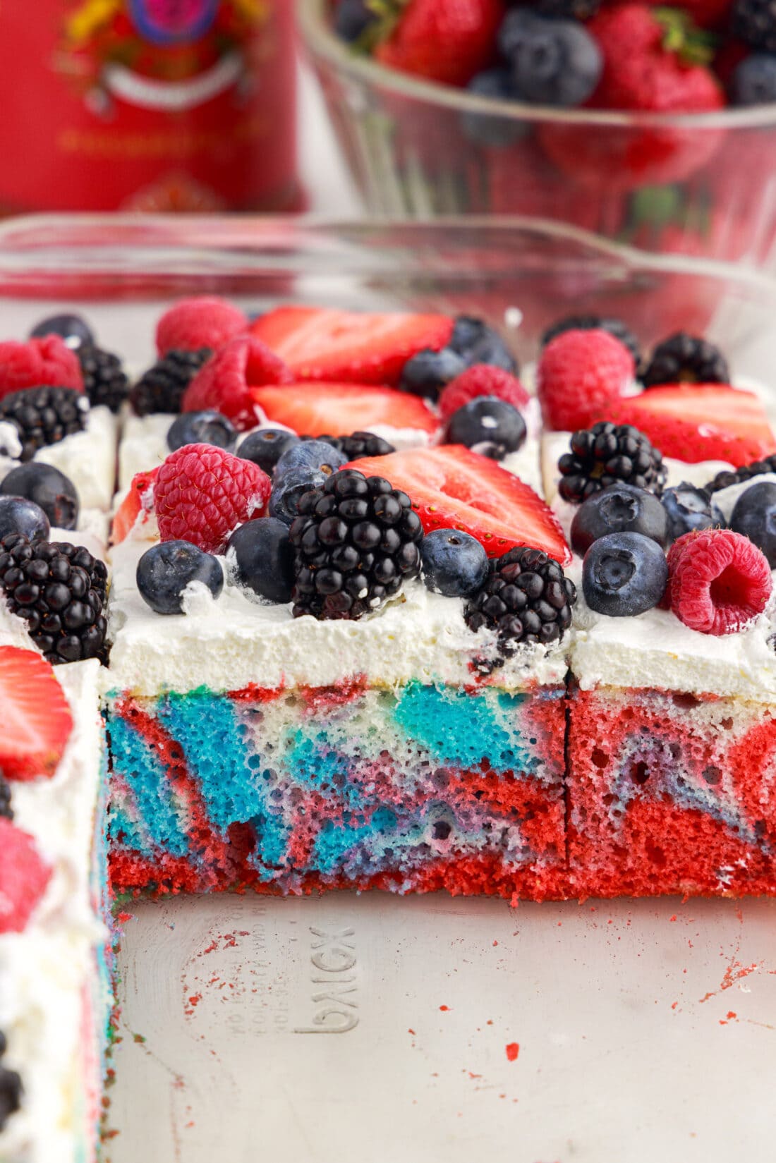 Photo of a pan of Red White and Blue Marble Cake with a few square pieces removed