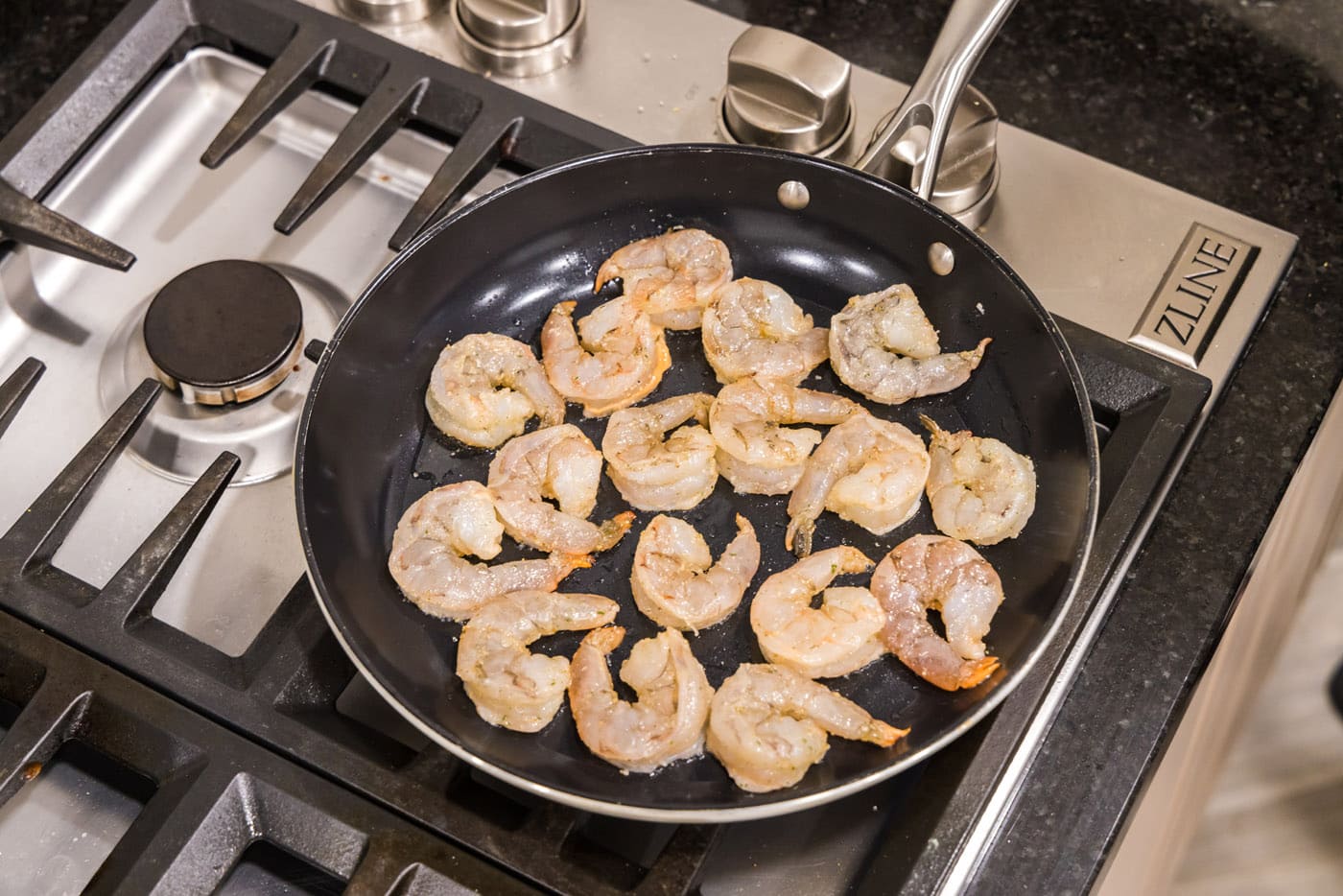 sauteeing shrimp in a skillet