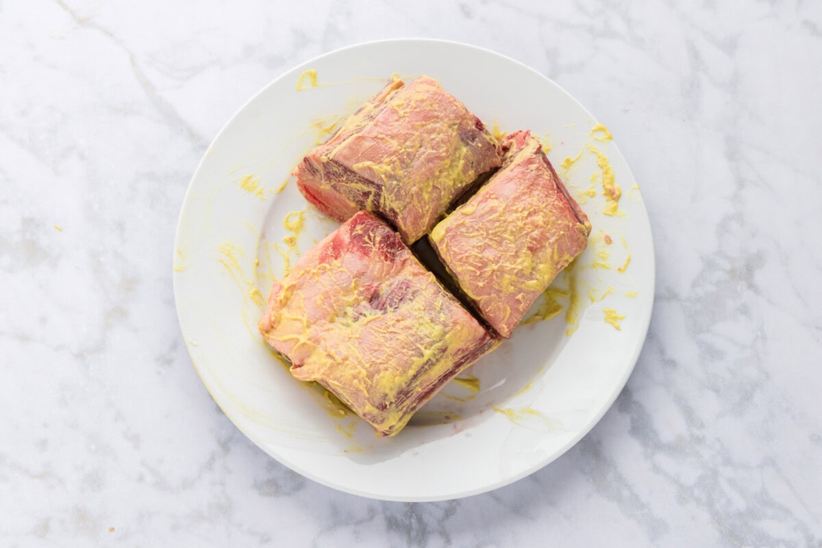 beef short ribs coated in dijon mustard