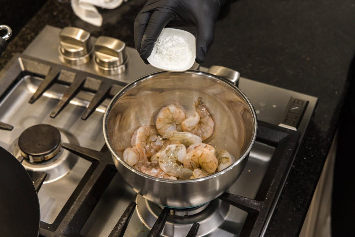 adding cornstarch to shrimp