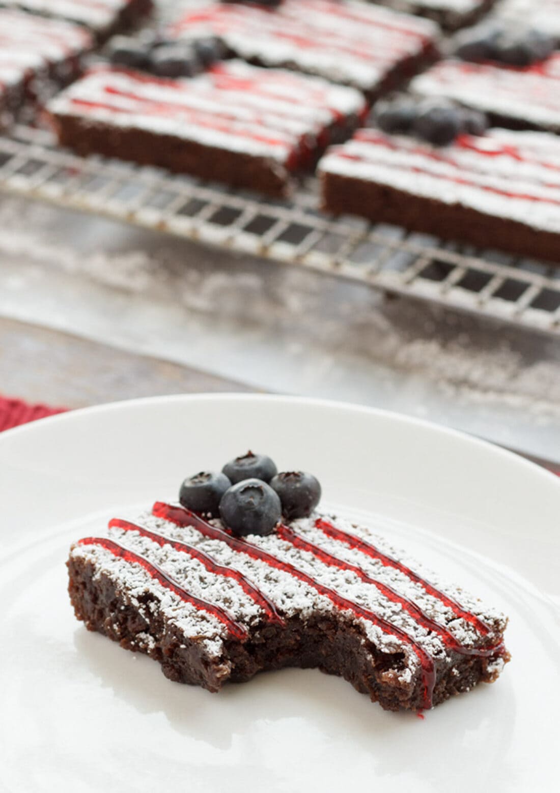 American Flag Brownie on a plate with a bite taken out