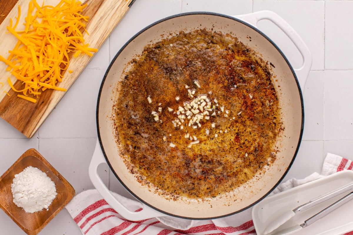 sauteeing garlic in melted butter and chicken drippings