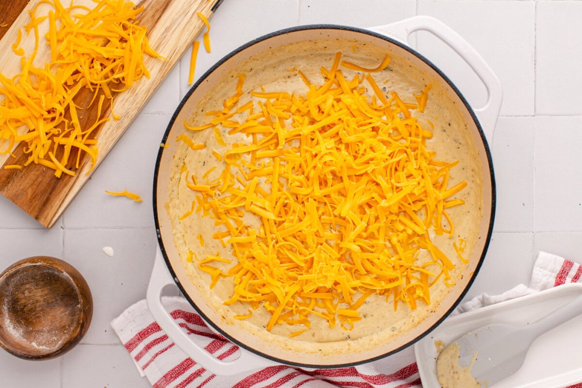 shredded cheddar cheese in creamy ranch sauce