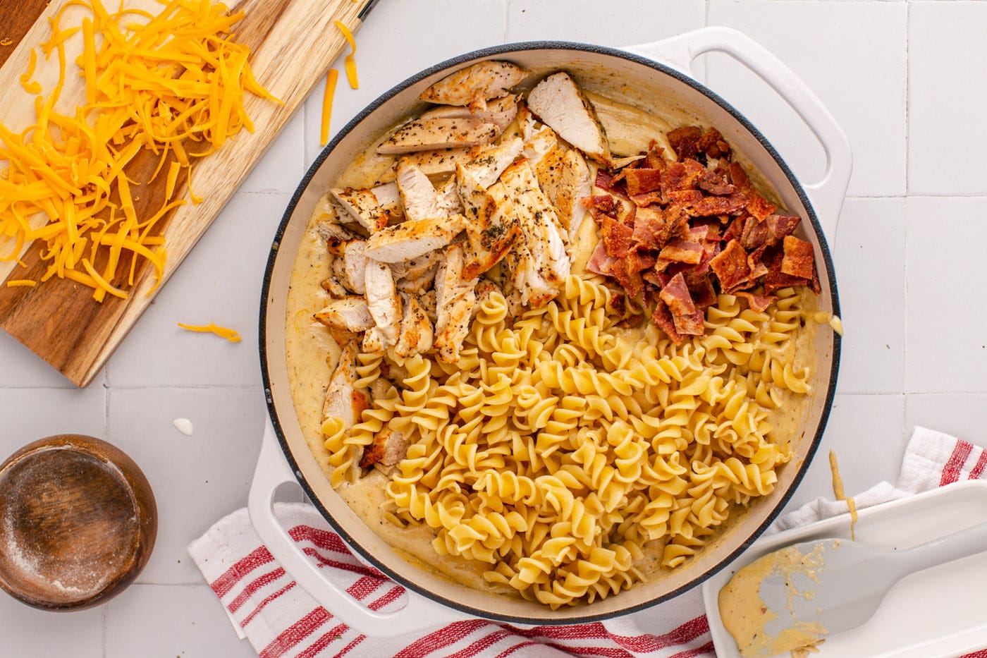 bacon, chicken, and pasta added to creamy ranch sauce
