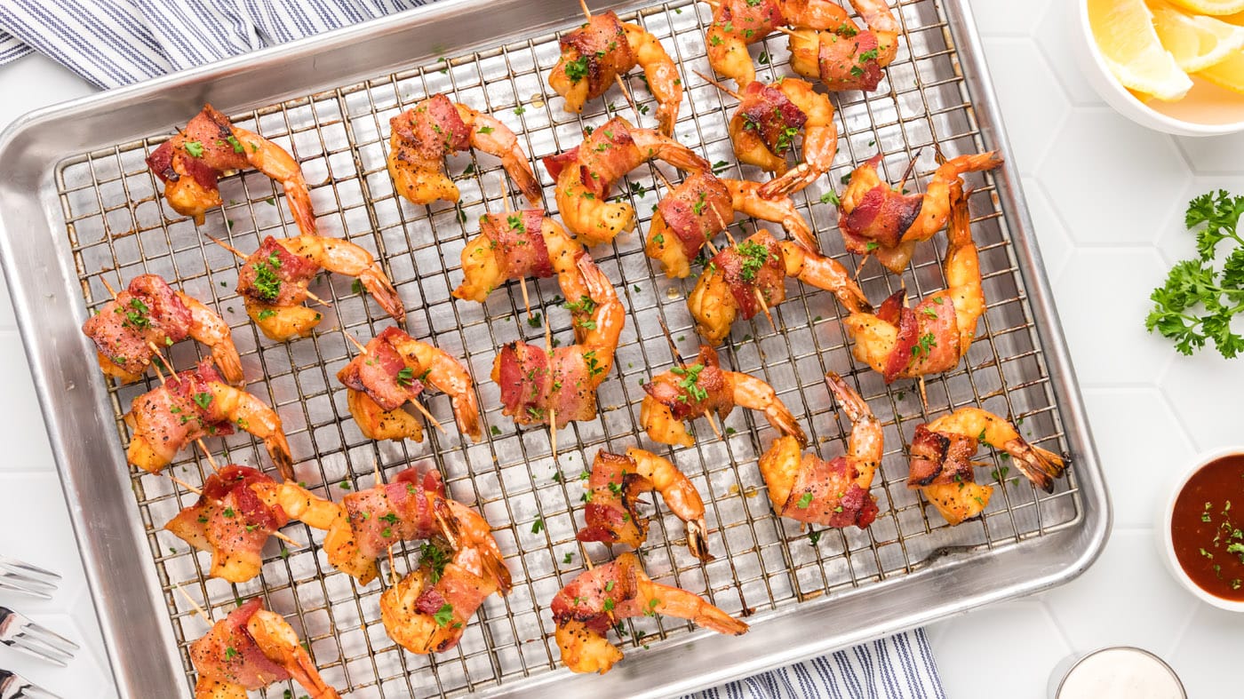 We're taking crisp, savory bacon and snuggly securing it around tender shrimp that's been coated in 
