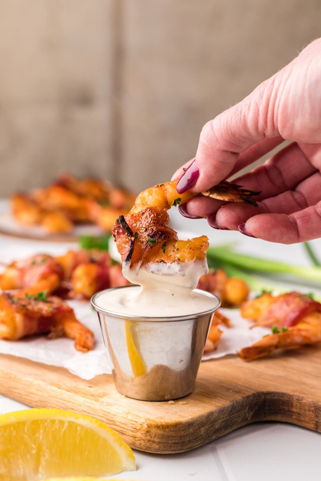 Bacon Wrapped Shrimp being dipped in ranch