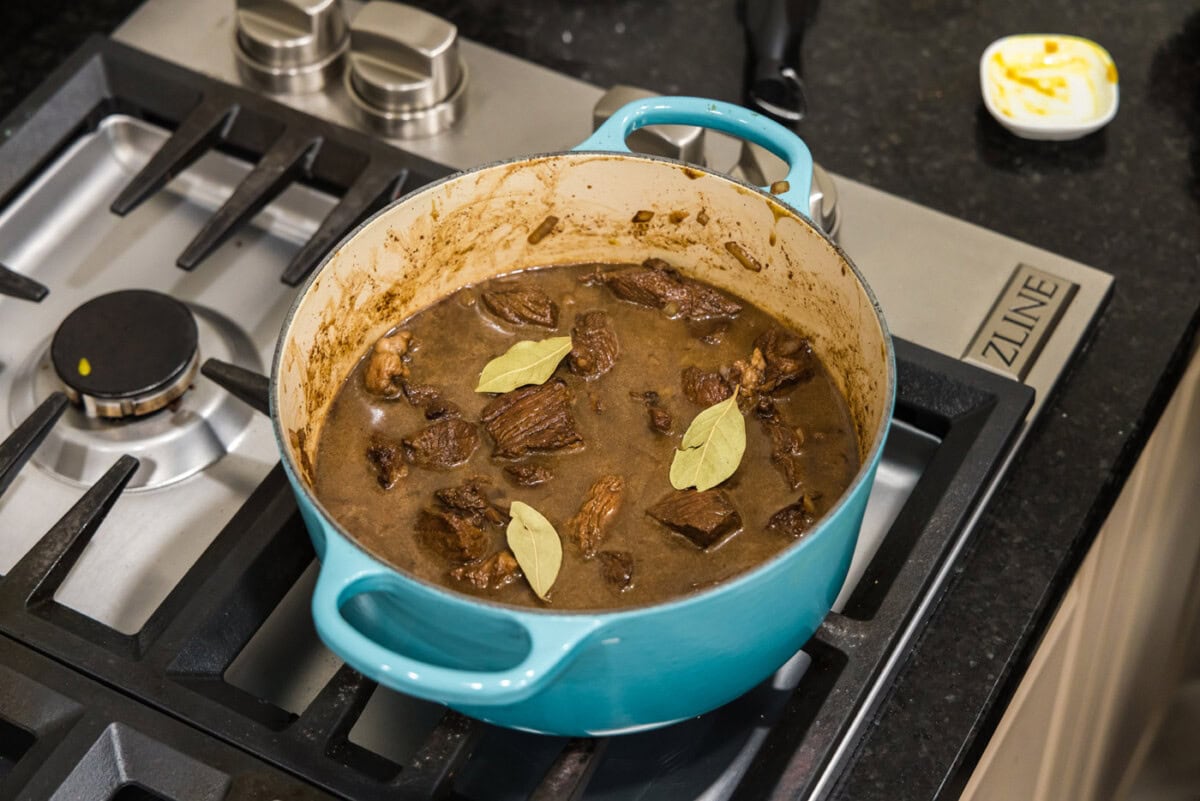 beef tips and gravy simmering on the stovetop