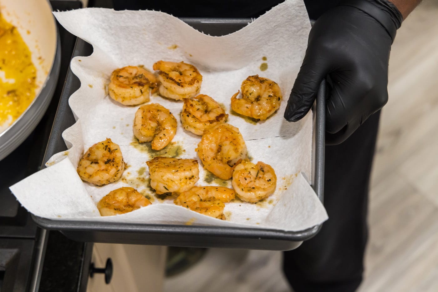 shrimp on a paper towel lined baking sheet