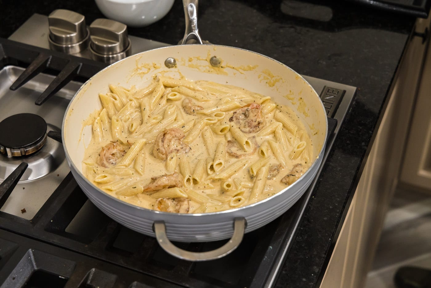 creamy cajun shrimp pasta on the stovetop