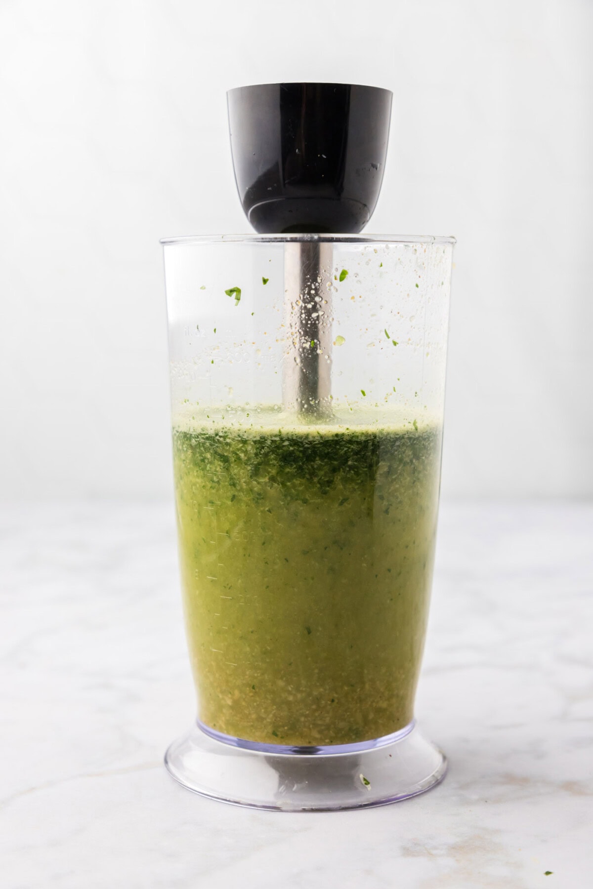 blitzing carne asada marinade with an immersion blender