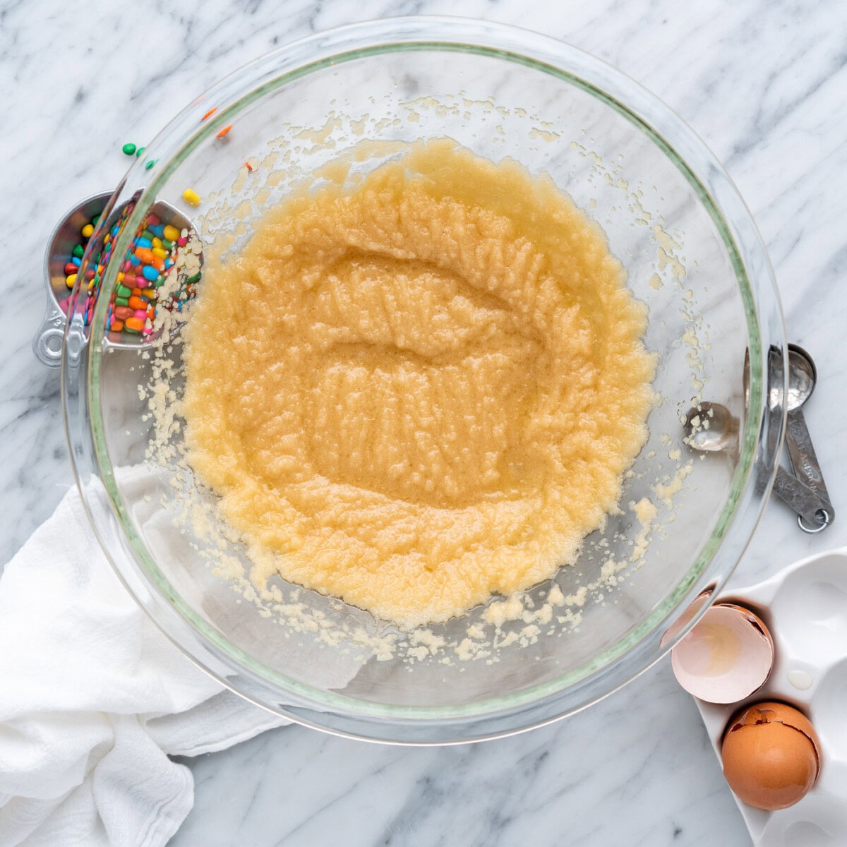 wet ingredients for brownies beaten in a bowl