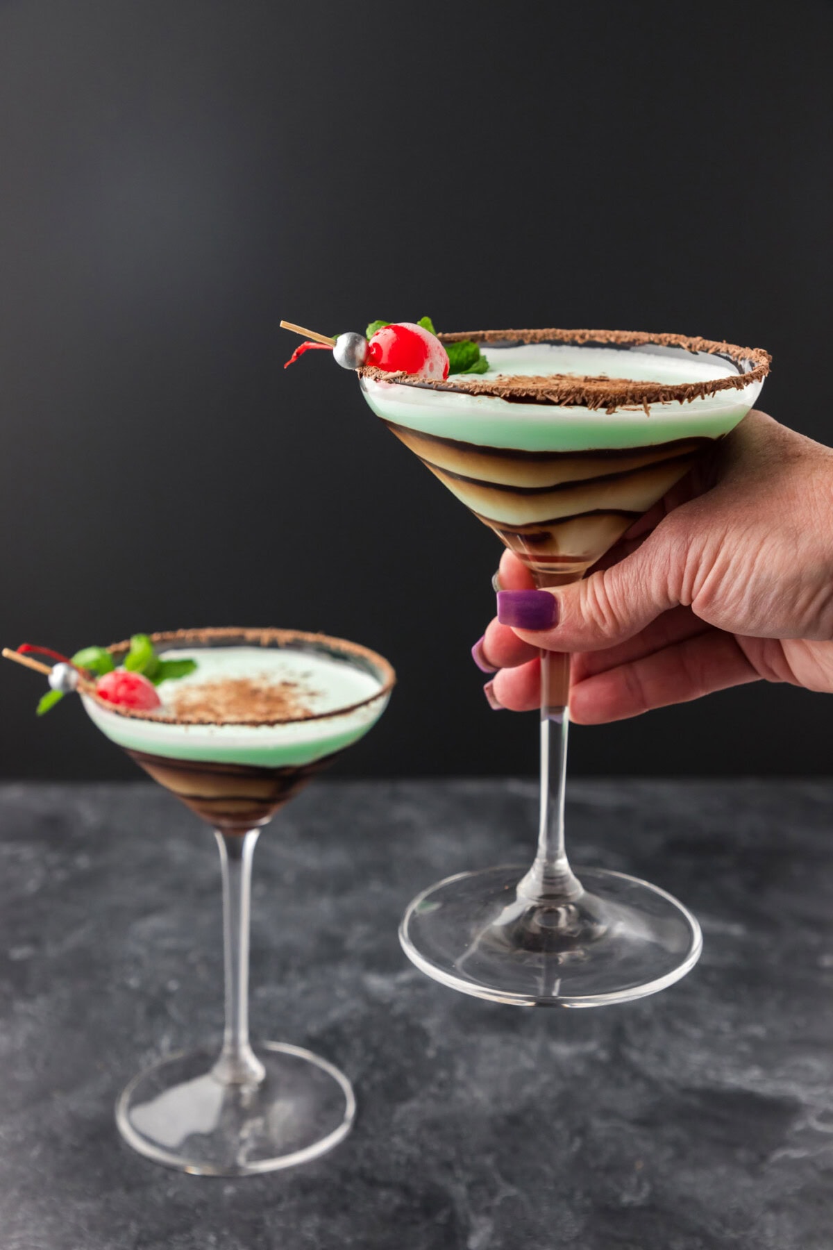 Hand holding up a Grasshopper Drink