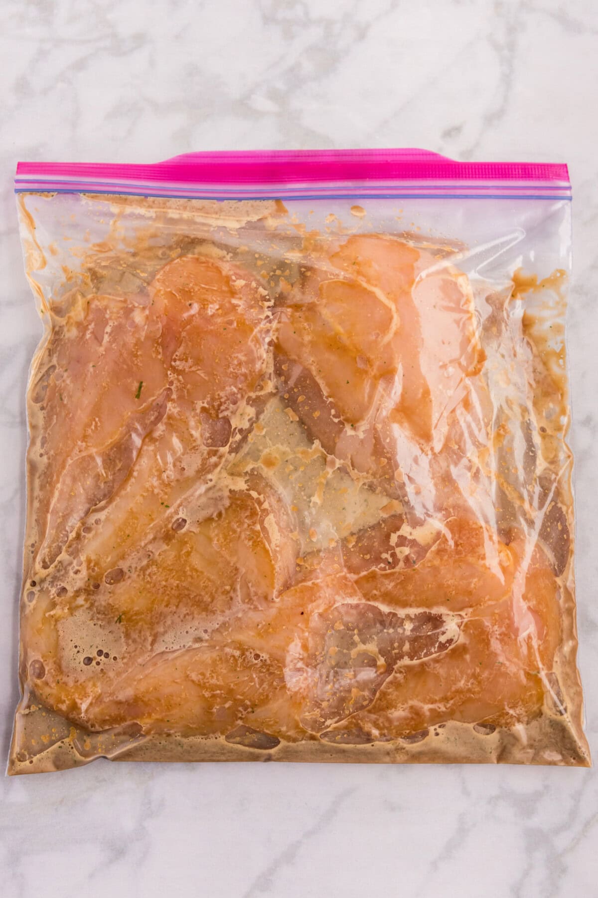 Honey Garlic Chicken Marinade in a zip top bag with chicken breasts 