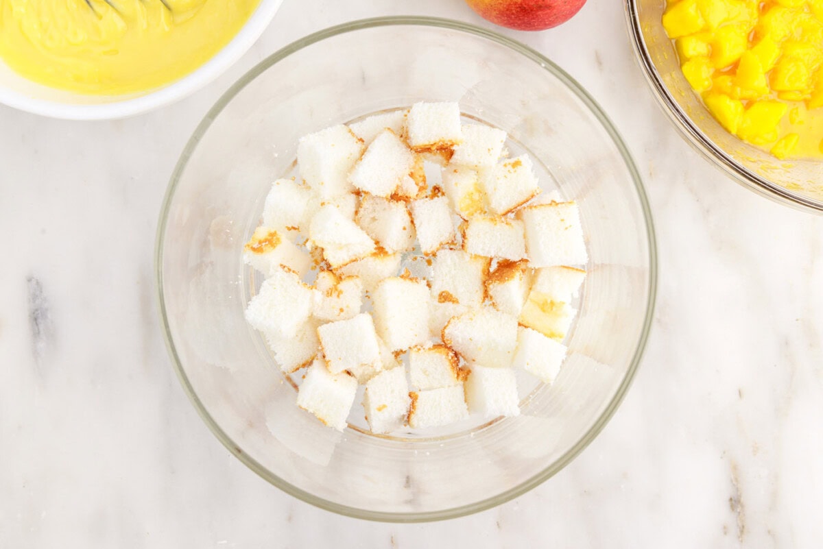 cubed angel food cake in a trifle dish