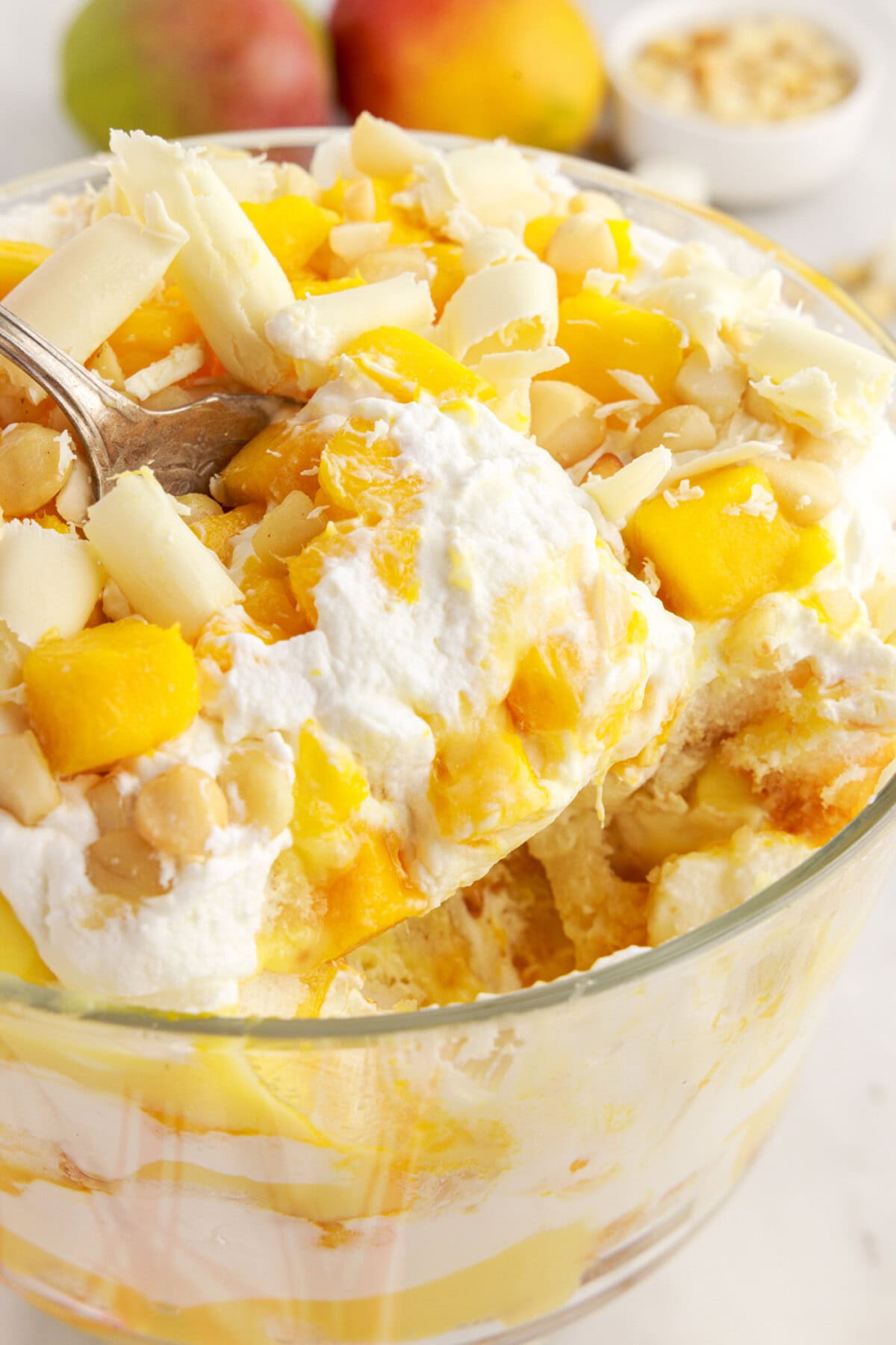 Mango Trifle being scooped out of the trifle dish