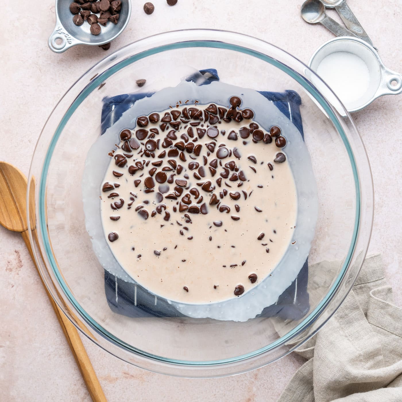 chocolate chips in a bowl with heavy whipping cream