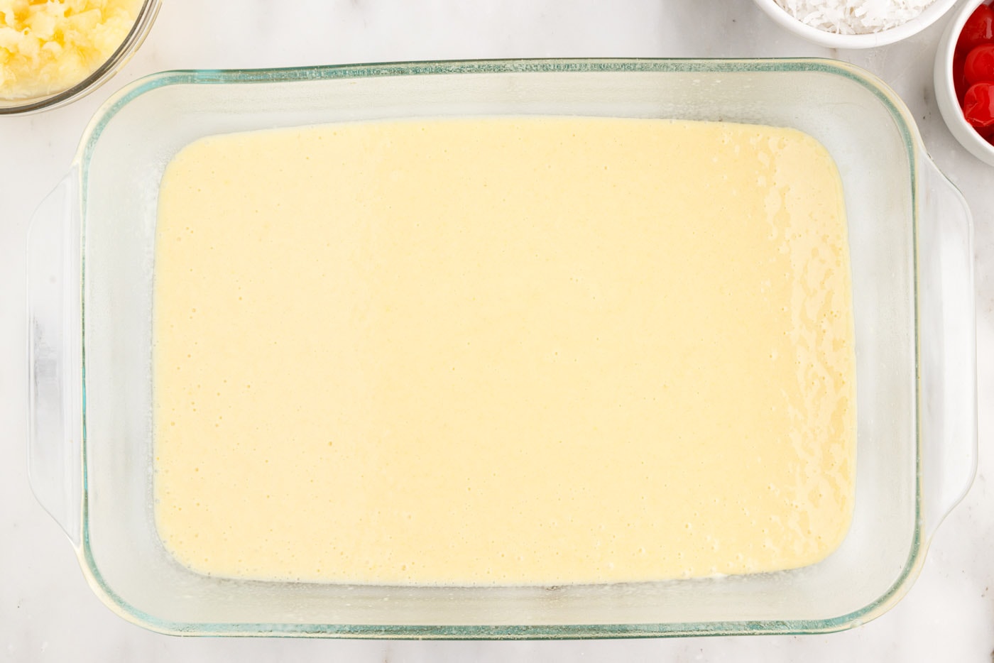 cake mix batter in a baking dish