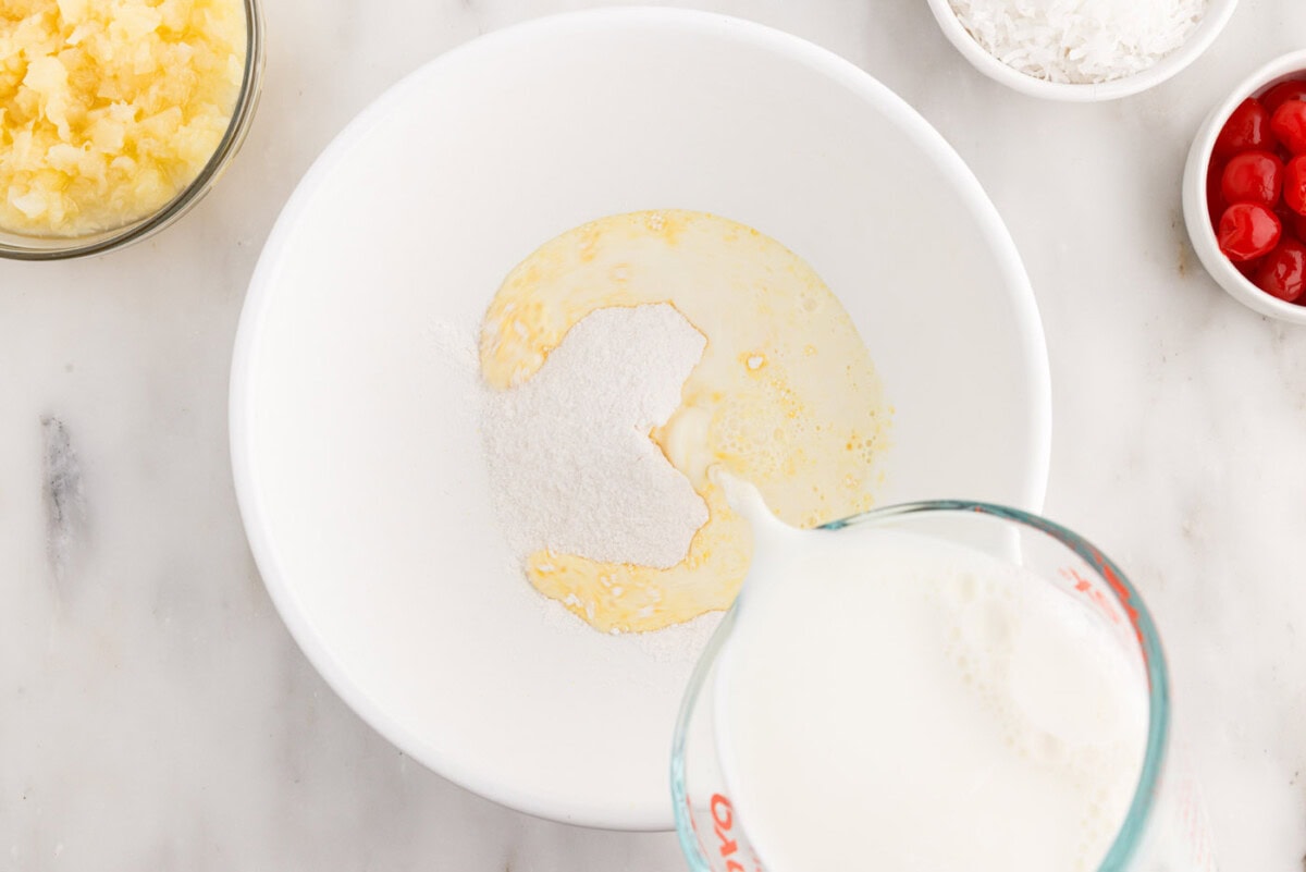 pouring milk into pudding mix