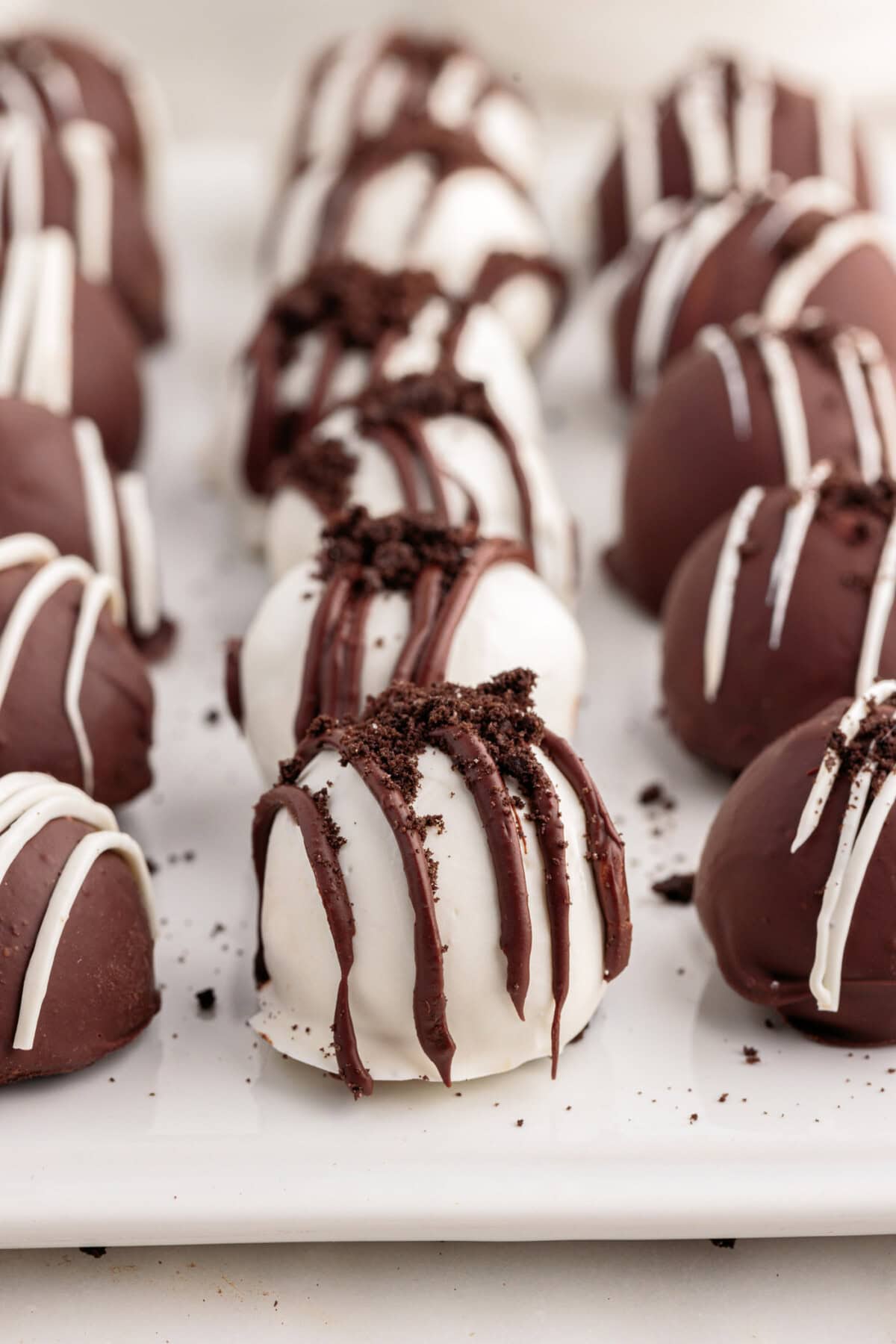 Oreo Truffles lined on on a tray with parchment paper