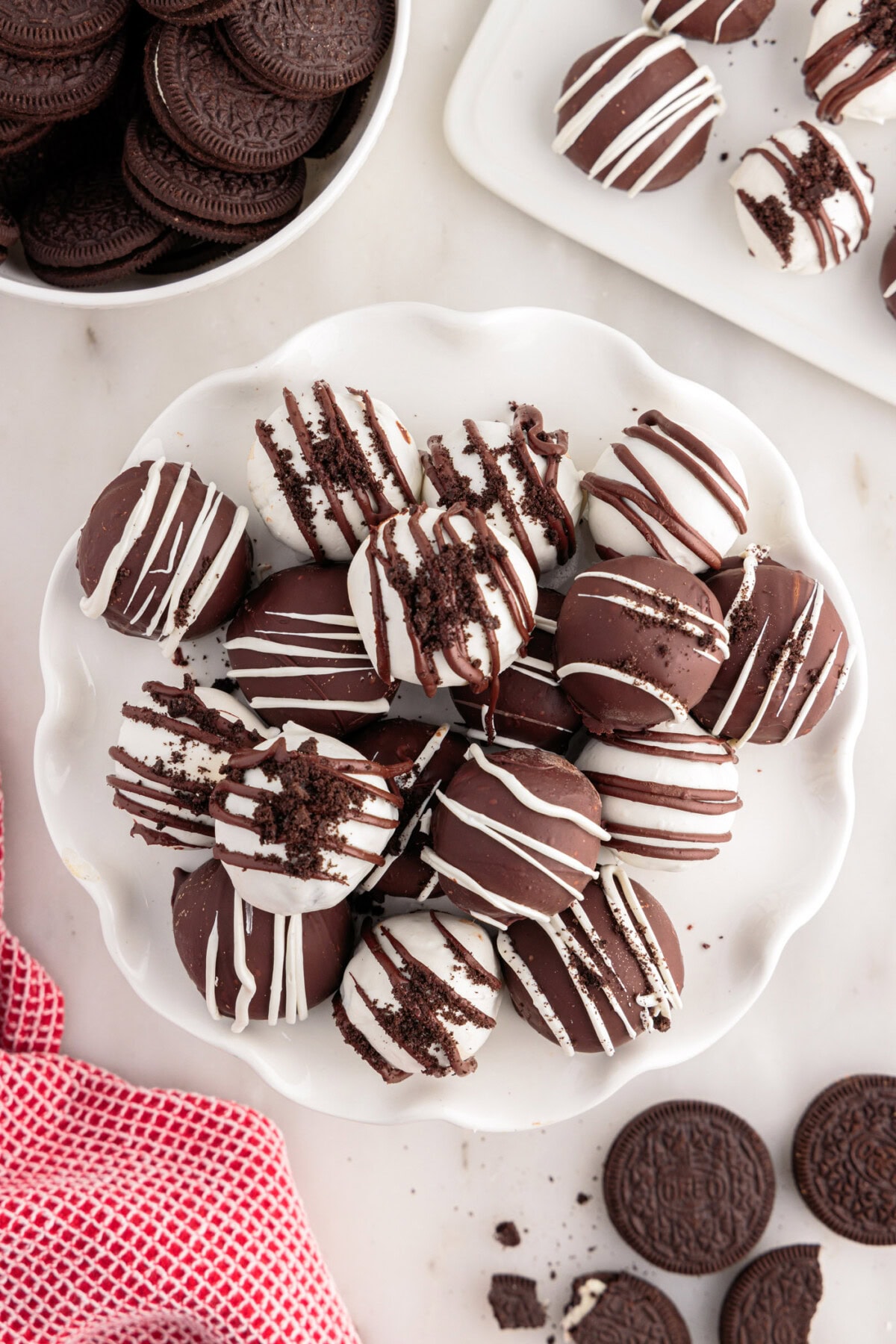 Oreo Truffles stacked on a white serving tray