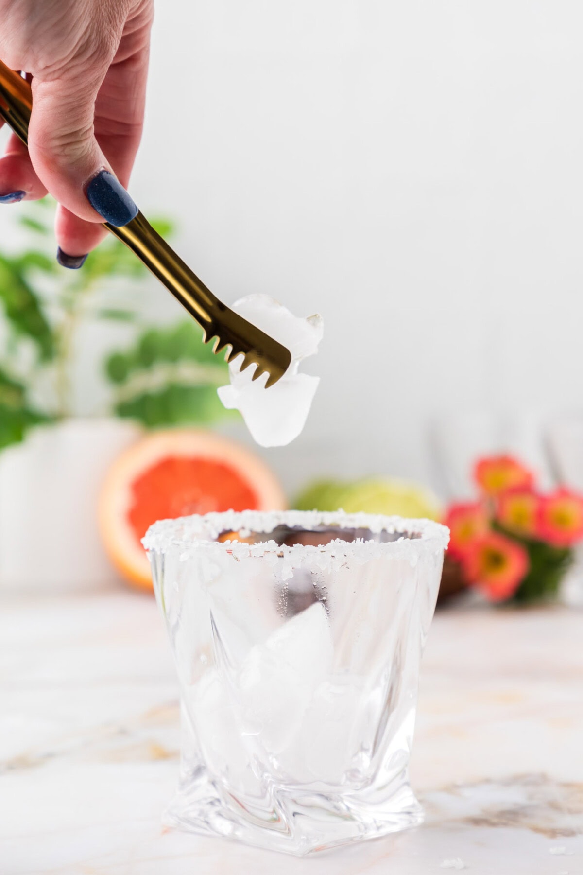adding ice to rock glass