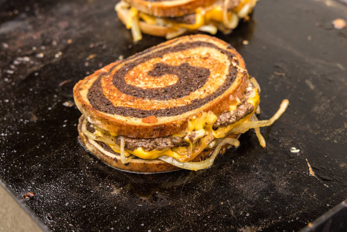 patty melt sandwich on the griddle
