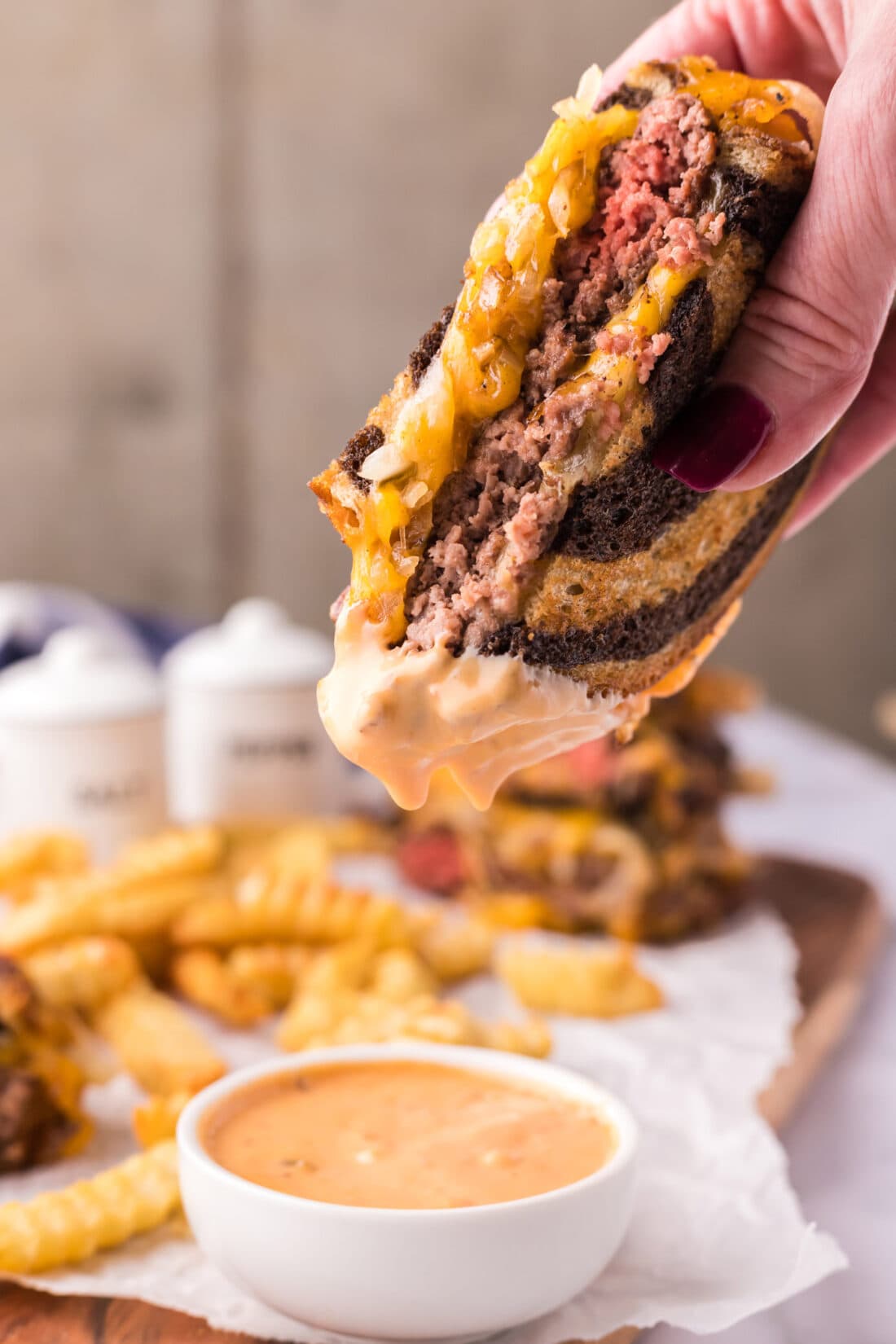 Patty Melt dipped in sauce