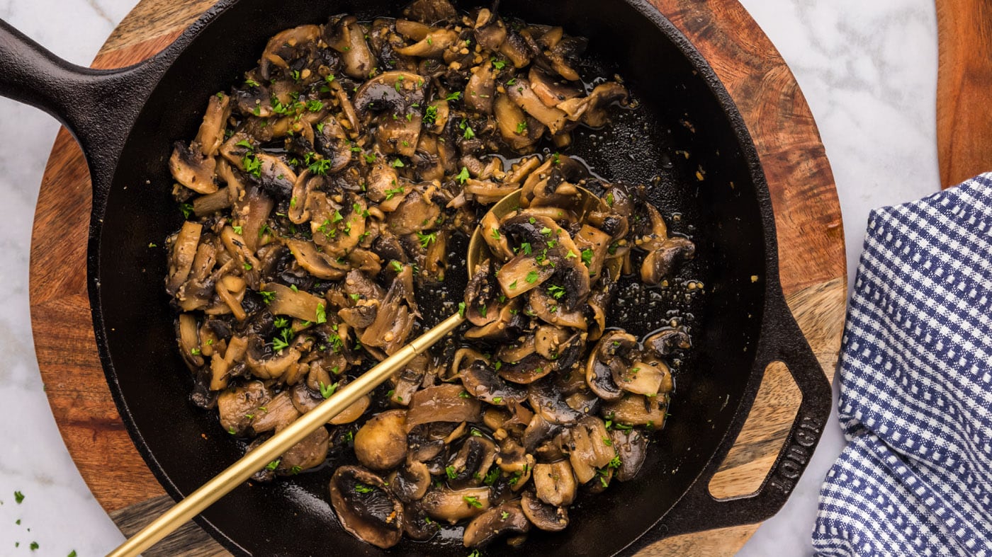 A dab of butter, fresh thyme leaves, garlic, and savory soy sauce help elevate these mushrooms into 