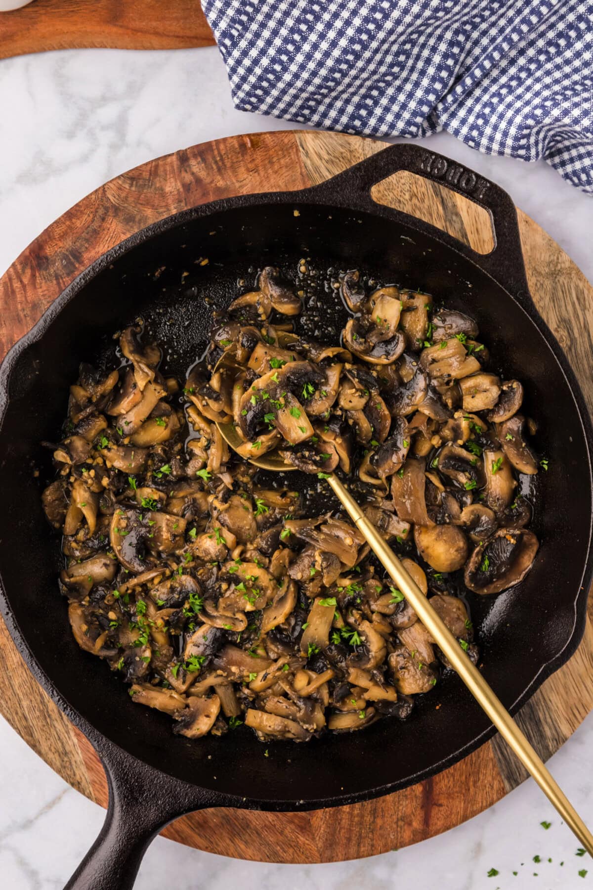 Skillet of Sautéed Mushrooms with a spoon