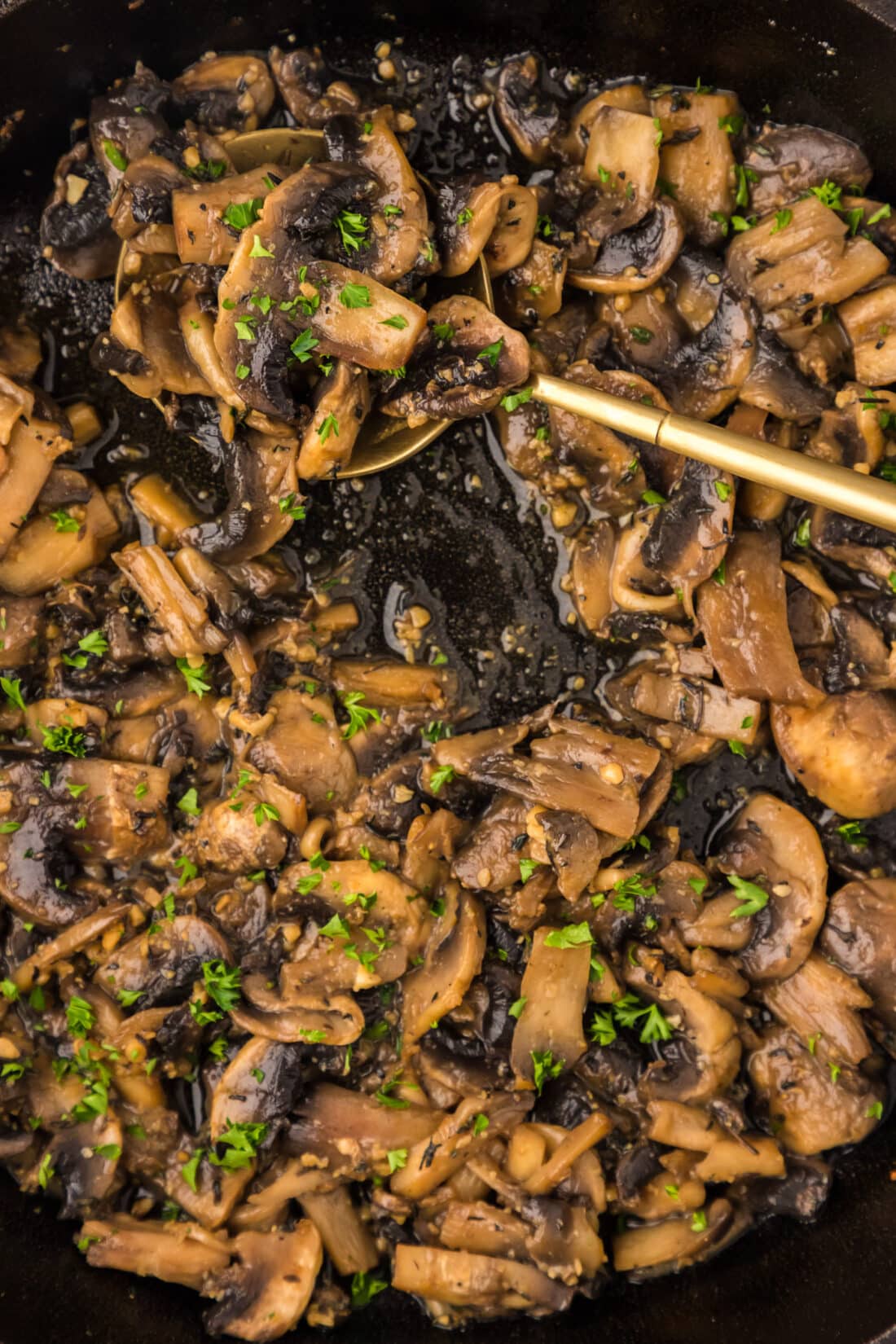 Close up photo of a skillet of Sautéed Mushrooms