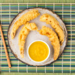 Shrimp Tempura on a plate with dipping sauce