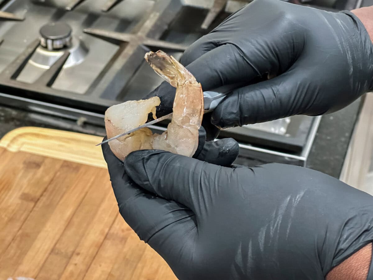 scoring the shrimp vein with a knife