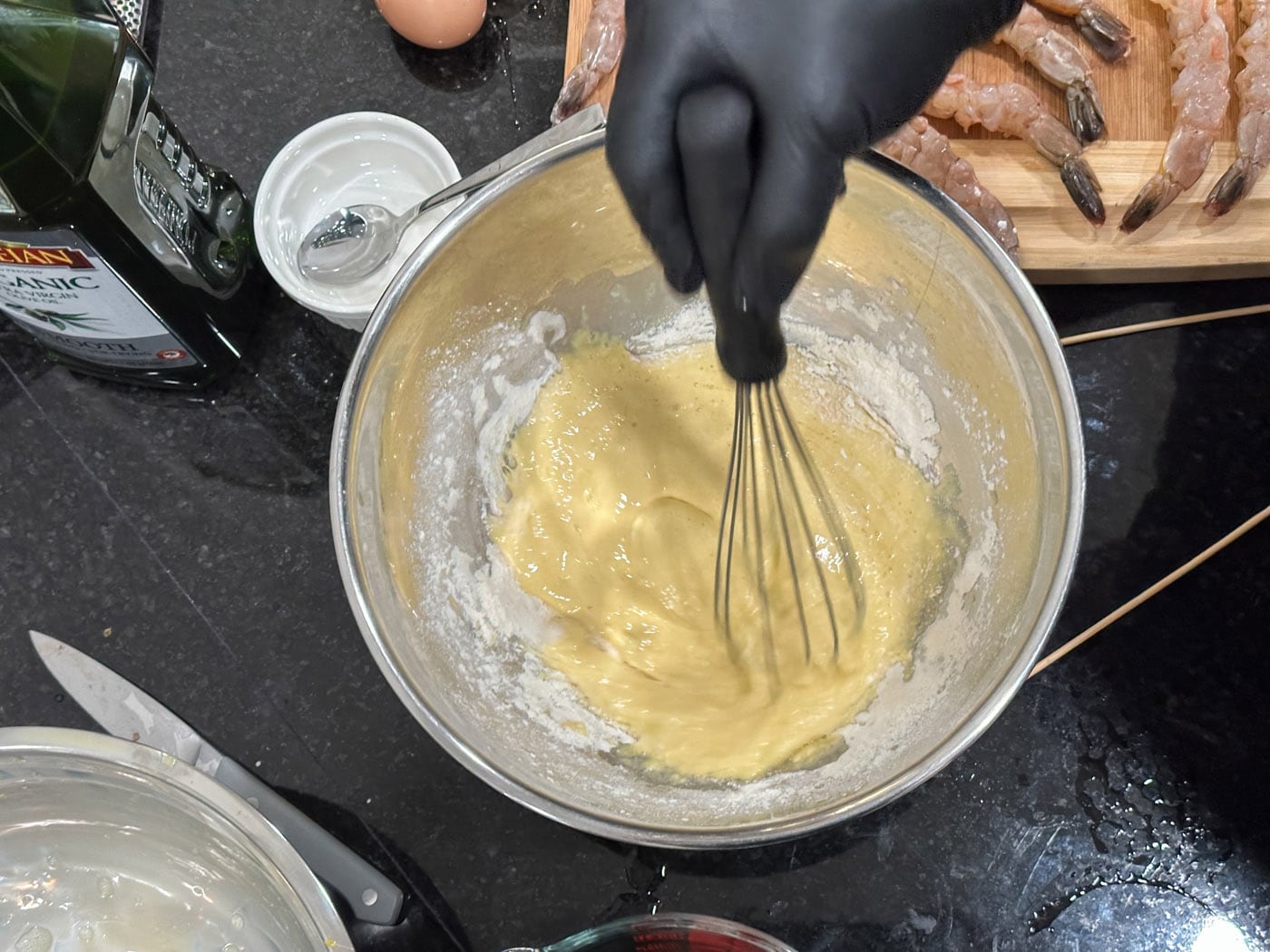 whisking eggs and flour in a bowl