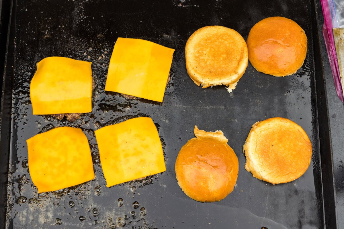 cheese on top of burger patties