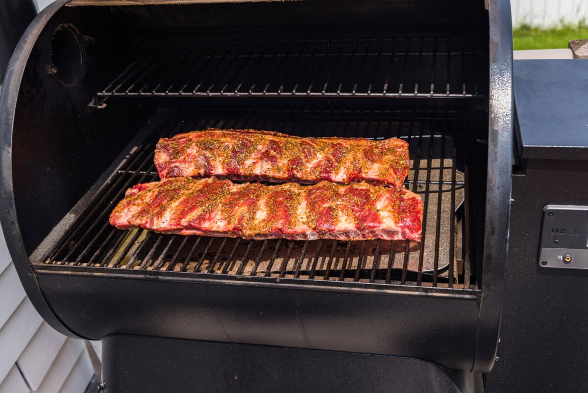 beef ribs on the smoker grates