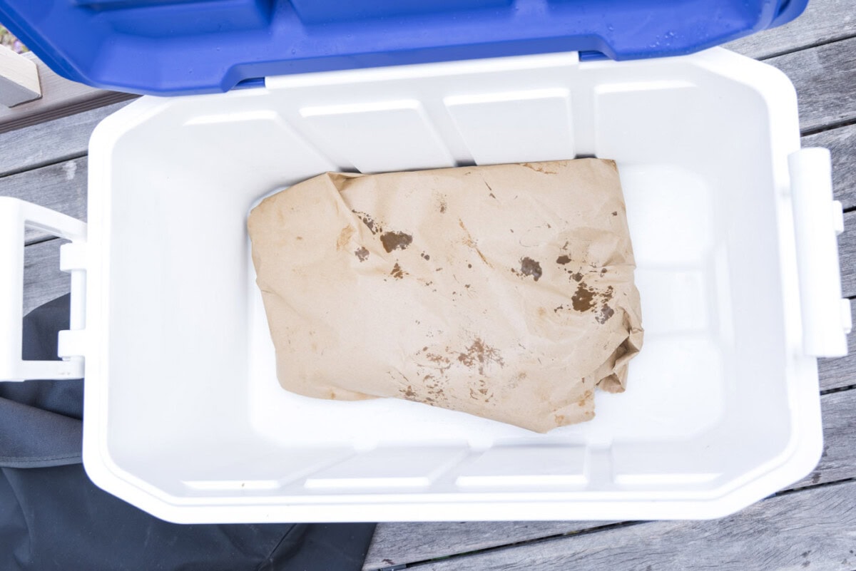 beef ribs wrapped and placed in a cooler to rest