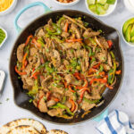 Steak Fajitas in a cast iron skillet