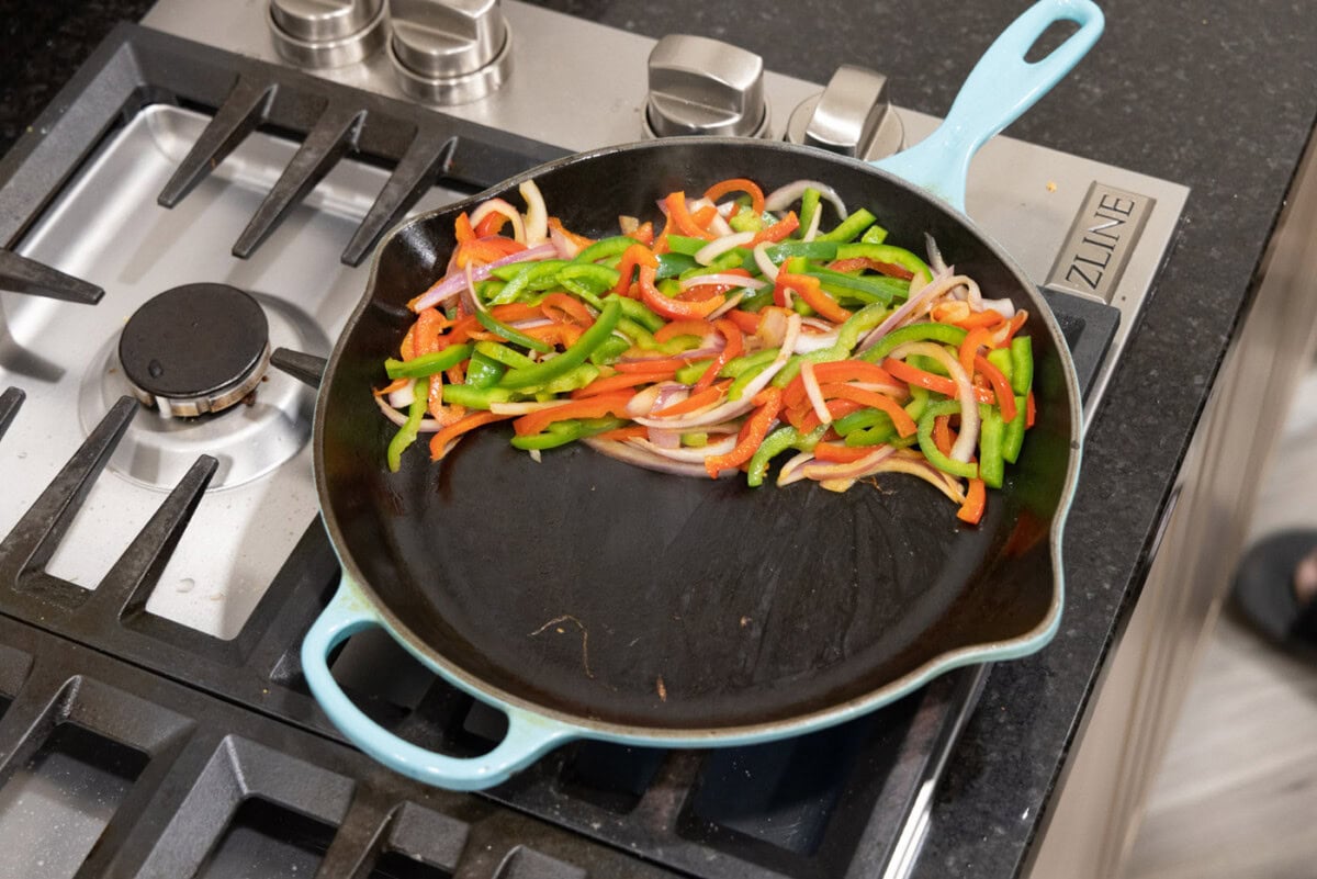 fajita veggies on one side of skillet