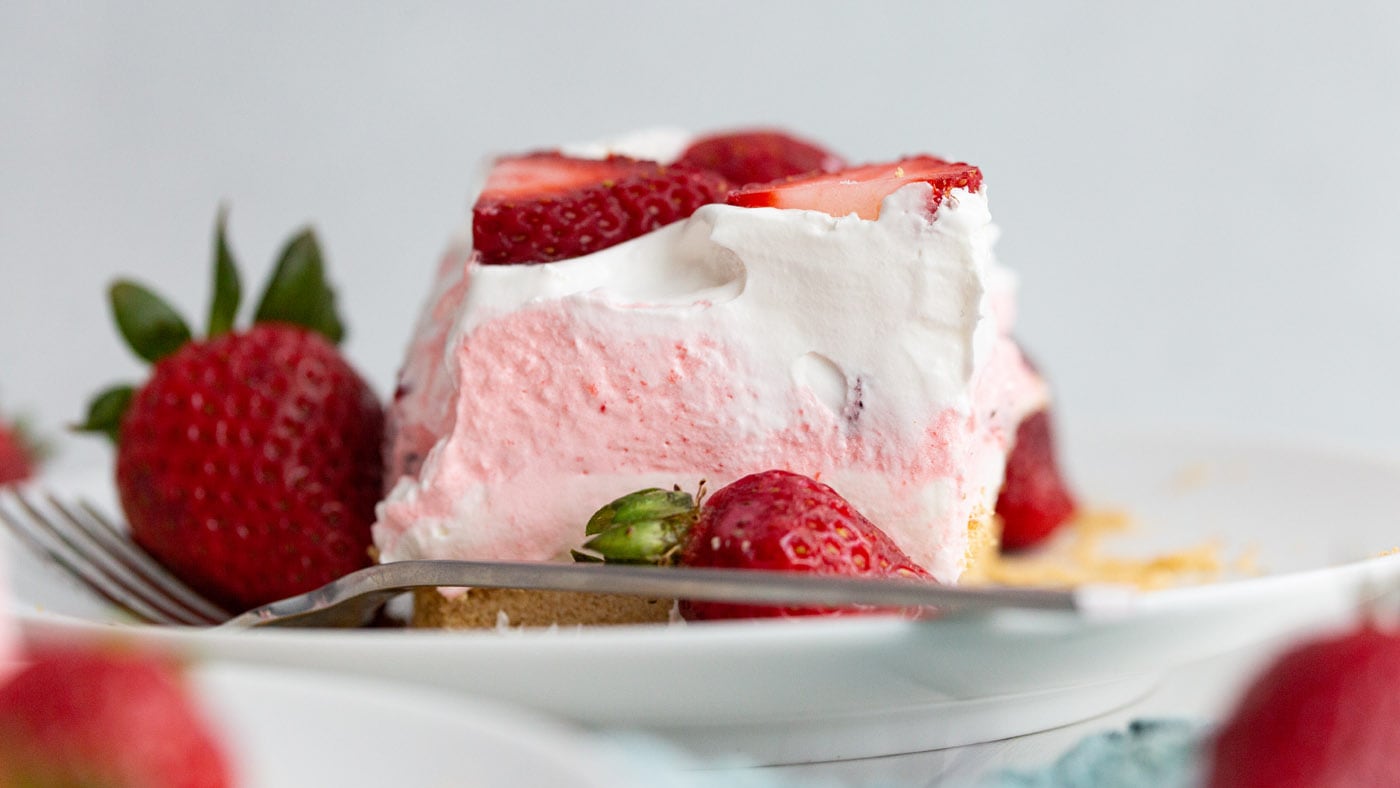 This strawberry lasagna has 3 layers of smooth cheesecake, strawberry jello, and cool whip with the 