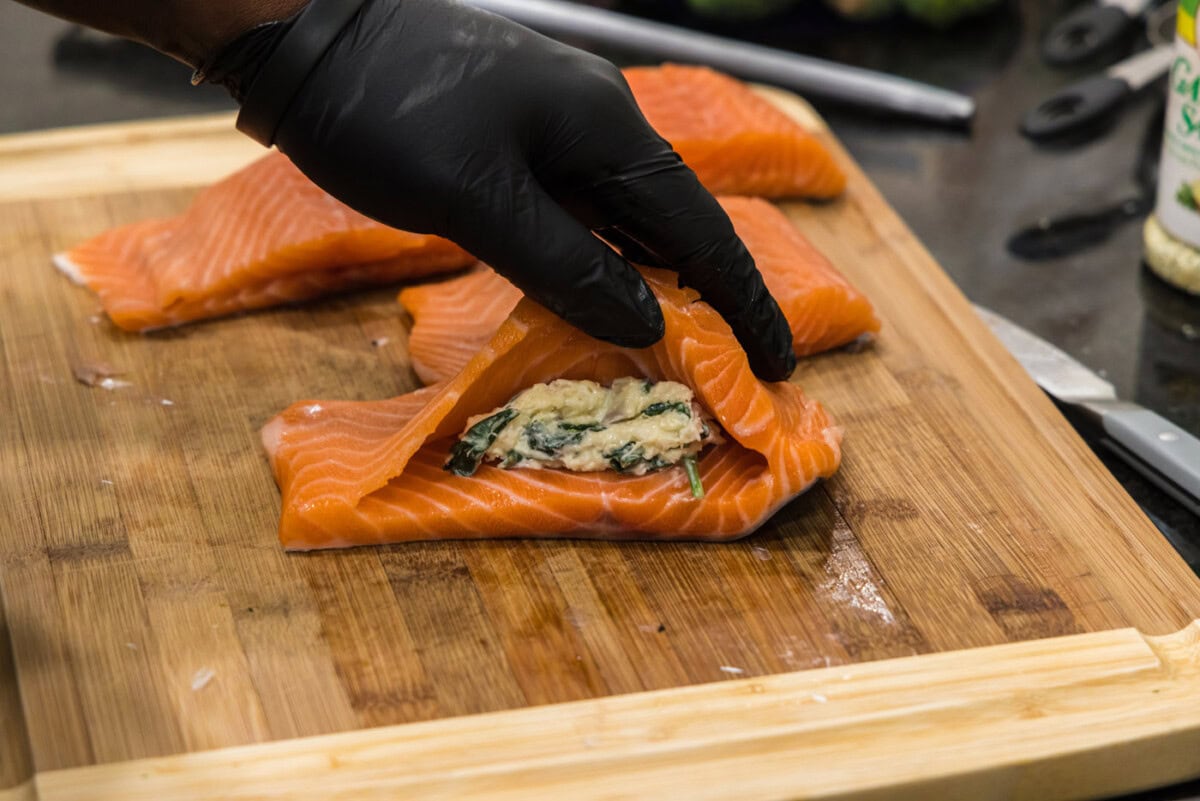 adding stuffing to salmon pocket