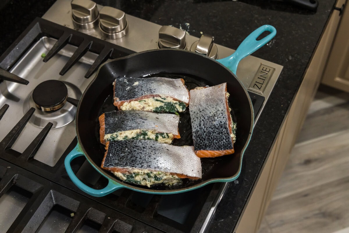 searing salmon skin side up in a skillet